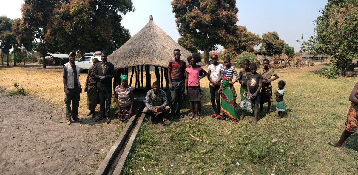 Water tanker delivering to a village