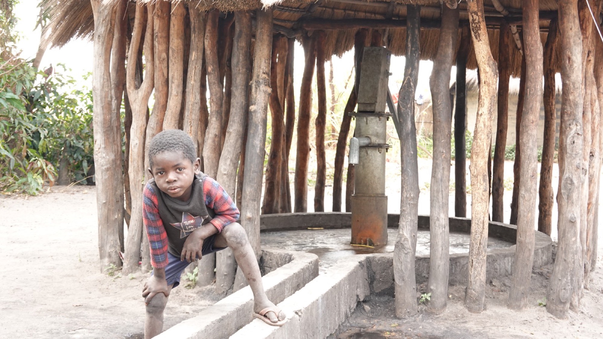 A child at a Crossworks borehole in western Zambia